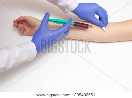 A Doctor Takes A Biochemical Blood Test From A Patients Vein For A Blood Test, White Background, Cop