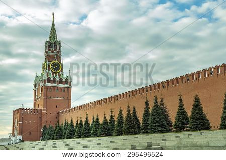 View Of The Kremlins Spasskaya Tower With A Clock And The Kremlin Red Wall In Moscow