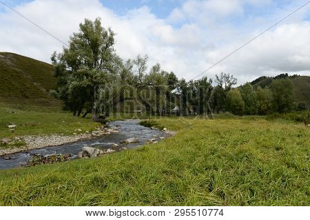 The Mountain River Yarovka In The Village Of Generalka Of The Altai Territory. Western Siberia. Russ