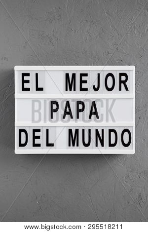 'el Mejor Papa Del Mundo' Words On Modern Board Over Concrete Background. Overhead, From Above, Flat