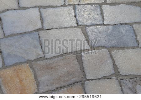 Quartz Surface Of A Multi-colored Street Road Paving Stones.