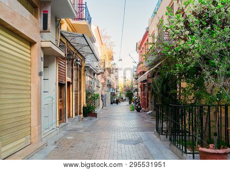 Small Cosy Street With Trees And Shops In Athens, Greece