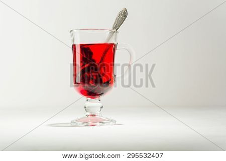 Transparent Glass Cup With Hot Red Tea From Hibiscus Or Hibiscus.