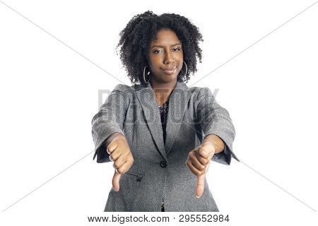 Black African American Female Businesswoman Isolated On A White Background Gesturing Thumbs Down