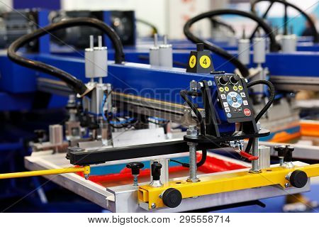 Automatic T-shirt Screen Printing Rotary Machine. Selective Focus.