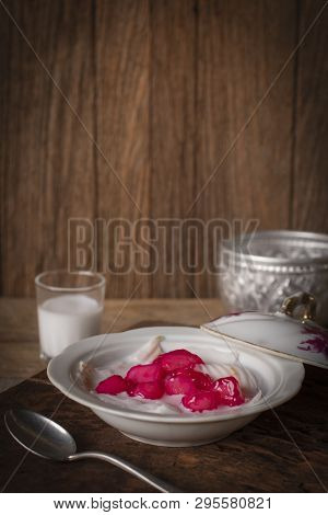 Thapthim Krop, Mock Pomegranate Seeds In Coconut And Syrup In The White Bowl On The Wood Table There