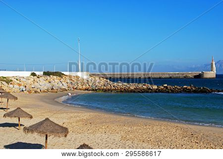 Tarifa, Spain - September 14, 2008 - View Tourists On The Beach With Views Of The Harbour Entrance L