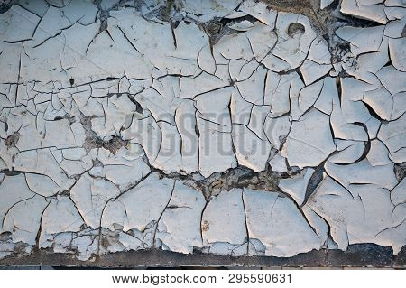 Old Wooden Board With Cracks And The Exfoliated Paint