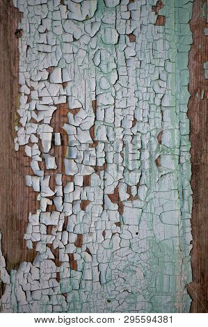 Old Wooden Board With Cracks And The Exfoliated Paint