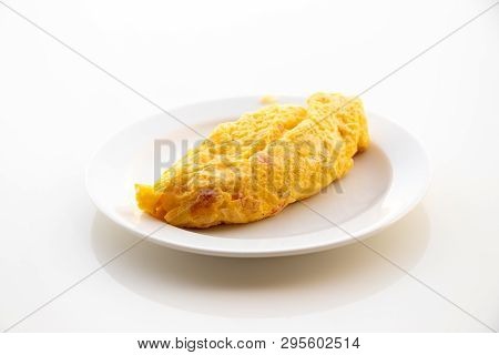 Egg Omlet In Dish Place On White Table Background