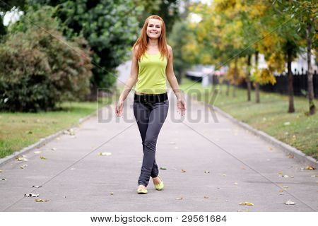 Beautiful woman walking in park