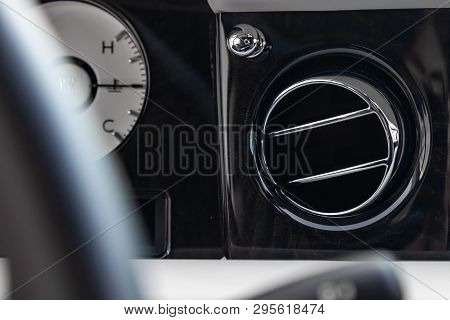 A Close-up View Of A Part Of The Interior Of A Modern Luxury Car With A View Of The Ventilation Defl
