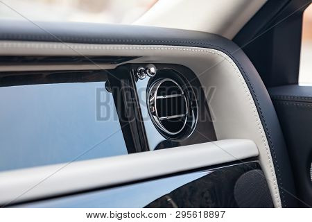 A Close-up View Of A Part Of The Interior Of A Modern Luxury Car With A View Of The Ventilation Defl