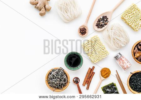 Chinese And Japanese Food Cooking With Ginger, Spices And Noodles On White Background Top View Mocku