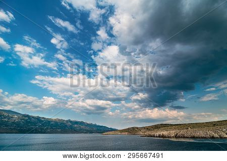 Beautiful Ocean And Dramatic Blue Sky With Clouds On Hot Summer Day., Rain In Background Over Paklen