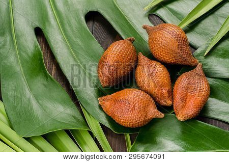 Snake Fruit, Rakum, Sala On Wood Background. Tropical Fruit.