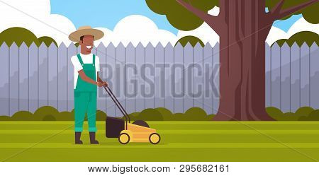 Man Gardener Cutting Green Grass With Lawn Mover African American Farmer Moving Garden Backyard Gard