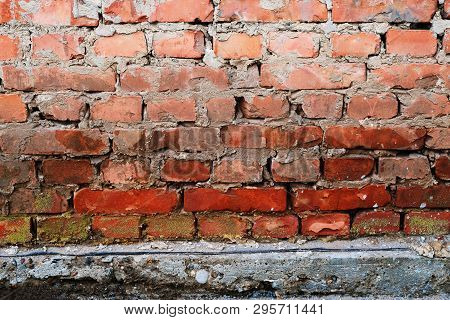 Brick Wall Background With Concrete Slub Beneath