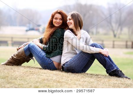 happy young women on field in summer