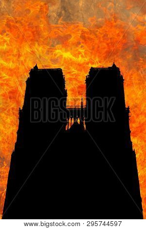 Backlit Silhouette Of The Fire In The French Gothic Cathedral Of Notre Dame In Paris, France In Apri