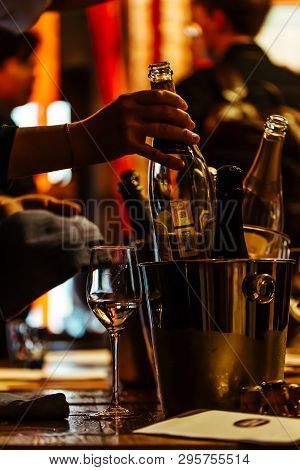 Moscow, Russia-march 30, 2019: Wine Tasting: There Is A Glass Of Wine On A Wooden Table, And A Silve
