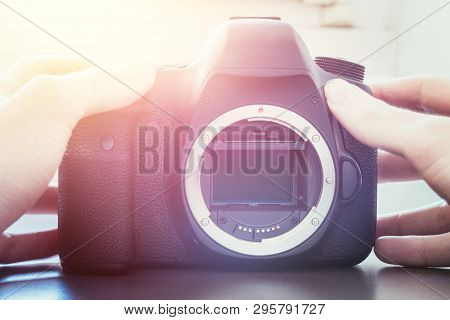 Photographer Is Using A Professional Camera, Open Sensor And Sunlight