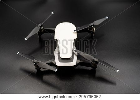 Drone - Flying In The Dark, On Black Background. Closeup On Dark. Portable Drones, View On The Drone
