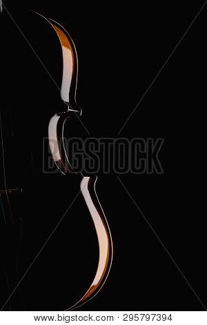 Close Up Of Classical Wooden Violoncello In Darkness Isolated On Black