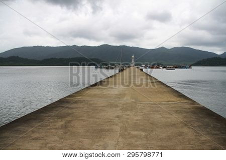 Cement Jetty Bridge Stretches To The Sea. Used For The Docking Of Ships, After Finding Out The Fish.
