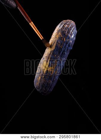 Beautiful Bright Eclair With Blets On A Dark Background.
