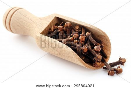 Organic Cloves In A Scoop Over White Abckground