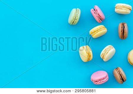 Brignt Macarons For Sweet Break On Blue Background Top View Mock Up