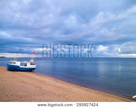 Fishing Boat On Baltic Sea Coast. Stormy Weather. Mechelinki, Poland, Pucka Bay.