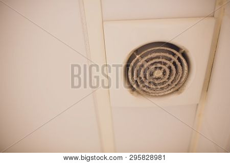 Wall Electric Extractor Fan For Bathroom. Closeup Dirty, Dust, Unsanitary Conditions.