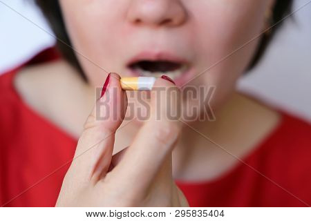 Woman Takes A Pill, Girl Putting Capsule In Mouth. Sick Female Taking Medicines, Painkiller, Antibio
