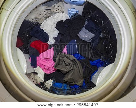 Top Loading Washing Machine Washes Laundry. Internal View Of A Washing Machine Drum During Wash. Top