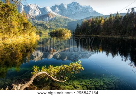 Incredible Autumn Landscape The Eibsee Lake In Front Of The Zugspitze Under Sunlight. Amazing Sunny 