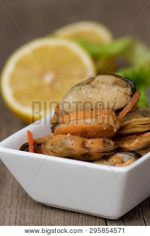 Pickled Mussels With Carrot, Lemon Juice And Oil.