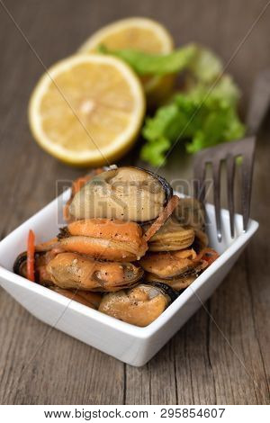 Pickled Mussels With Carrot, Lemon Juice And Oil.