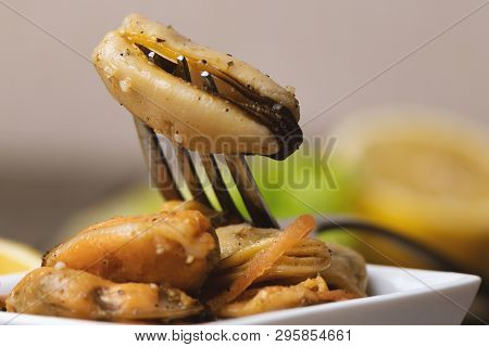 Pickled Mussels With Carrot, Lemon Juice And Oil.