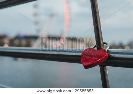 London, Uk - April 13, 2019: Red Heart Love Lock On Millennium Bridge, A Steel Suspension Pedestrian