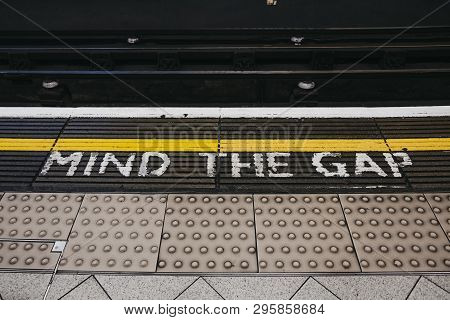 London, Uk - April 13, 2019: Mind The Gap Sign An A Platform Of Embankment Underground Station. Lond