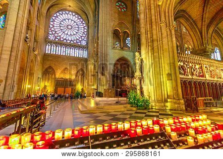 Paris, France - July 1, 2017: People Lighting The Candles In Central Nave Altar Of Notre Dame Of Par
