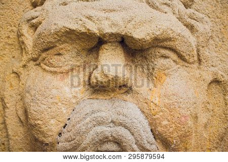 Barcelona, Spain, August 11 2018: Bas Relief Decorative Mask Sculpture On The Walls Of Famous Comedi