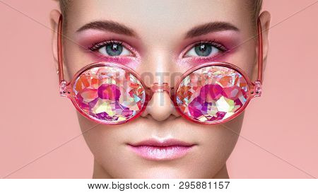 Portrait Of Beautiful Young Woman With Colored Glasses. Beauty Fashion. Perfect Make-up. Colorful De