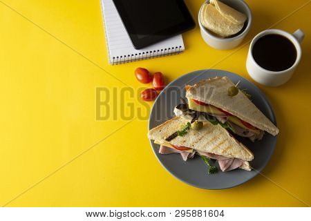 Snacks, Fast Food Concept. Eatting At Work Place. Fresh Club Sandwich, Vegetables, Coffee, Potato Ch