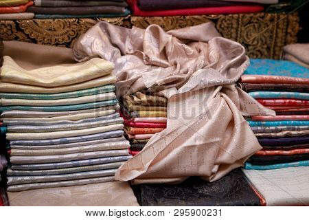Thin Beautiful Handmade Pashmina Shawls Lie On The Counter