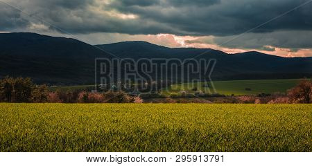 Panoramic Photo Of Povazsky Inovec Hill In Slovakia With Small Village In The Valley On Sunset. Land