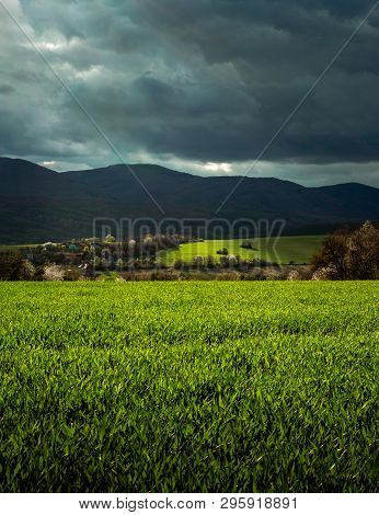 Povazsky Inovec Hill In Slovakia With Small Village In The Valley On Sunset. Landscape Photo Of Whea