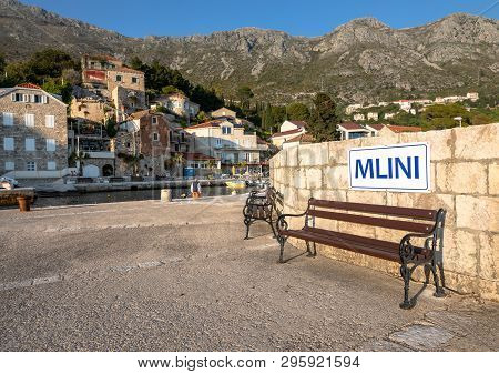 Mlini, Croatia - April 2019: Bench And Sign In The Idyllic Village Of Mlini In Dubrovnik, Croatia